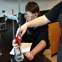 University of Connecticut Early College Experience (UConn ECE) Concurrent Enrollment – Two students conducting a science experiment 