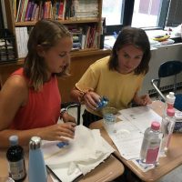 University of Connecticut Early College Experience (UConn ECE) Concurrent Enrollment – Two female high schools students conducting science experiment